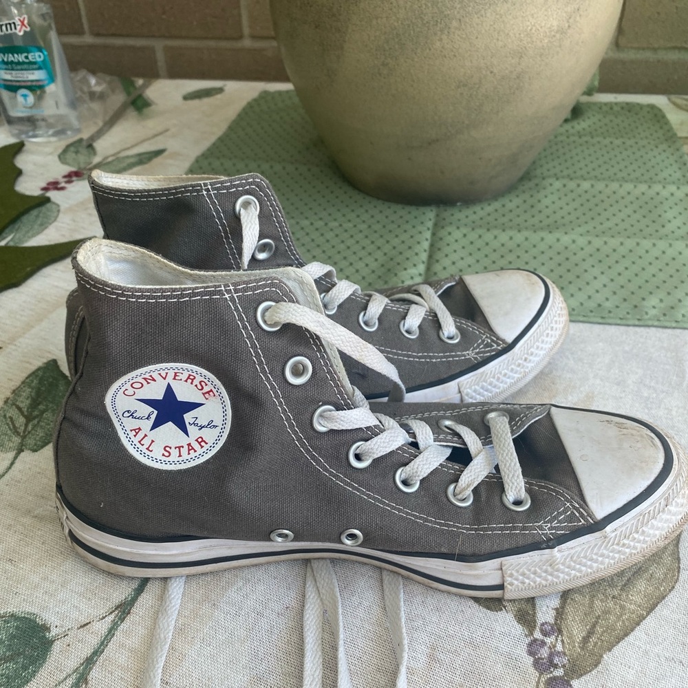 Worn grey converses